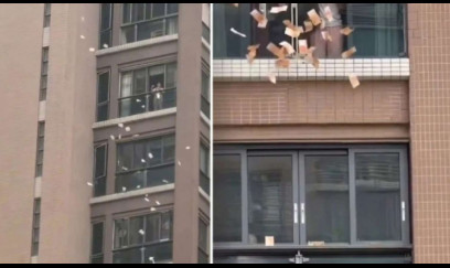 Pəncərədən küçəyə 1 milyon atdı - VİDEO
